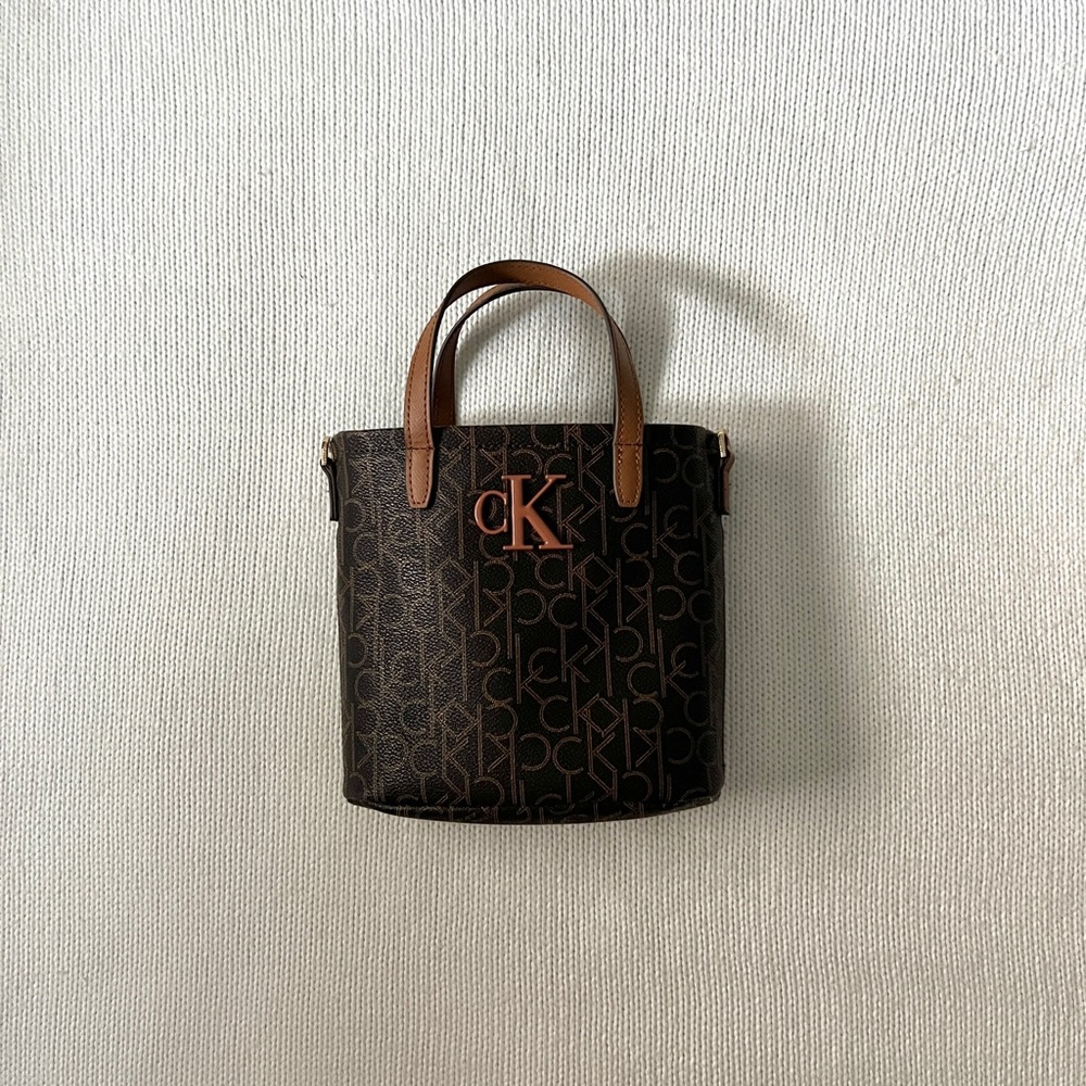 Calvin Klein Signature Hand Zip Purse in Brown